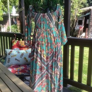 Torrid, turquoise hot pink, and yellow roses pattern dress with gathered bodice.